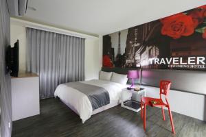 Postel nebo postele na pokoji v ubytování Guo Chen Hotel
