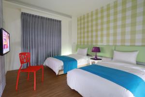 Postel nebo postele na pokoji v ubytování Guo Chen Hotel
