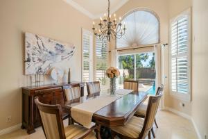 a dining room with a table and chairs and a window at @ Marbella Lane - Captivating Home in Rowland Hts in Rowland Heights