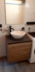 a bathroom with a bowl sink on a counter at Volt76 - Como lake apartment in Como +21 photos