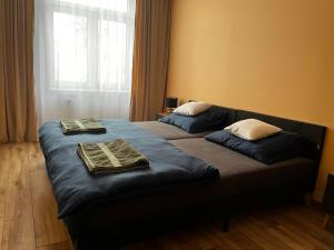 a bedroom with two beds with towels on them at Komfortowy Apartament w centrum in Jaworzno