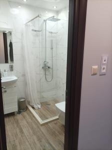 a bathroom with a shower and a toilet and a sink at One Bedroom Apartment 37- Trakia 54 А in Plovdiv