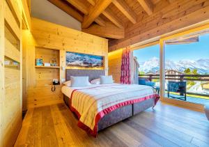 Postel nebo postele na pokoji v ubytování Nendaz 4 Vallées & SPA 4* Superior + 37 fotografií