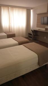 Hotel 7 Itajaí房間的床