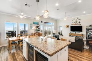 a kitchen and living room with a large counter top at Purple Paradise in Freeport