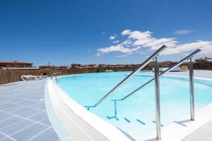 a large swimming pool on top of a building at Blue Star Villa in Lajares