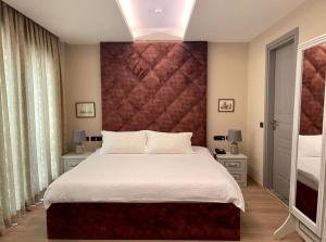 Postel nebo postele na pokoji v ubytování Vila Shard Boutique Hotel