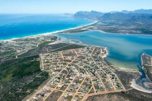 an aerial view of a city next to the ocean at Fisherhaven Guest House in Hermanus