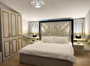 Postel nebo postele na pokoji v ubytování Vila Shard Boutique Hotel