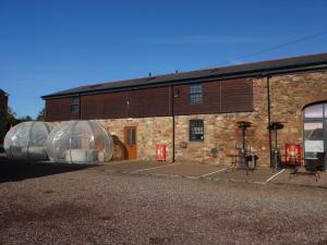 a building with two domes on the side of it at Claudius Caesar, Bowness-on-Solway in Bowness-on-Solway