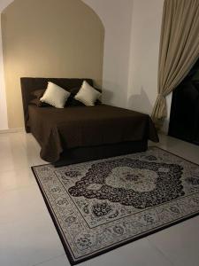 En eller flere senge i et værelse på Homestay Kemaman Fyna04 dekat Pantai Geliga