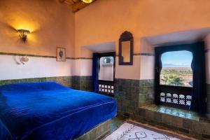 Ένα ή περισσότερα κρεβάτια σε δωμάτιο στο Hôtel Riad Dar Daïf