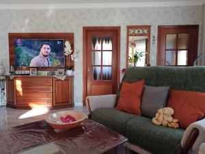 TV a/nebo společenská místnost v ubytování Harmath Vendégház Balatonszárszó + 9 fotografií