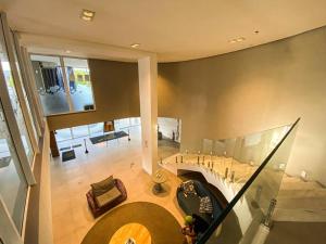 an overhead view of a house with a spiral staircase at Cabo Frio - Loft Premium Royalle in Cabo Frio