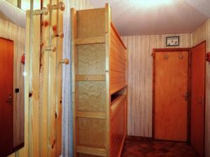 a room with an empty closet with a wooden door at Appartement Châtel, 2 pièces, 4 personnes - FR-1-198-113 in Châtel