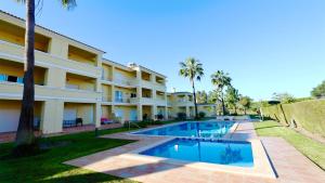 an exterior view of a resort with a swimming pool at Adam's Place (Garça Real)CD242 - Clever Details, Sleeps 4 people, Wifi, Garage in Vilamoura