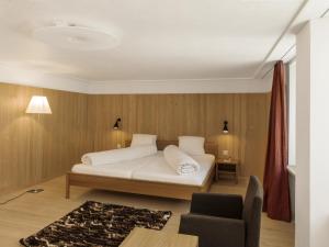Postel nebo postele na pokoji v ubytování Hotel Alpina