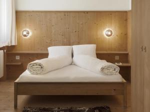 Postel nebo postele na pokoji v ubytování Hotel Alpina