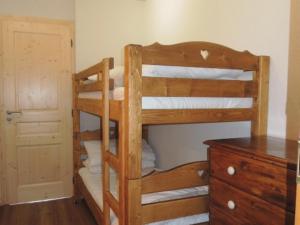 a bunk bed room with two bunk beds and a dresser at Appartement Châtel, 2 pièces, 4 personnes - FR-1-198-159 in Châtel