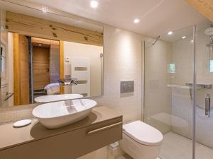 a bathroom with a sink and a toilet and a shower at Chalet La Clusaz, 5 pièces, 10 personnes - FR-1-437-80 in La Clusaz