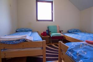 Postel nebo postele na pokoji v ubytování Apartmani Rocen