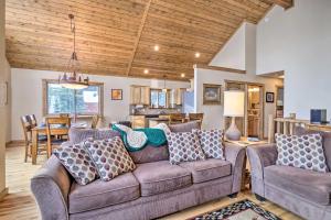 a living room with a couch and a dining room at 22STR-00367 Fairplay Cabin ~ 6 Mi to Downtown! in Fairplay