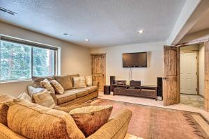 a living room with a couch and a flat screen tv at 22STR-00367 Fairplay Cabin ~ 6 Mi to Downtown! in Fairplay
