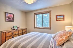 a bedroom with a bed and a dresser and a window at 22STR-00367 Fairplay Cabin ~ 6 Mi to Downtown! in Fairplay