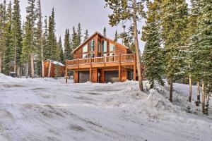 a log cabin in the woods in the snow at 22STR-00367 Fairplay Cabin ~ 6 Mi to Downtown! in Fairplay