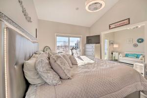 a bedroom with a large bed with pillows at Sleek Ludington Haven Less Than 1 Mi to Lake Michigan in Ludington