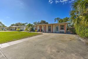 a house with a driveway in front of it at Bright Naples Home - 4 Mi to Botanic Gardens! in Naples