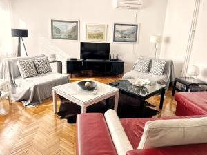 a living room with couches and a coffee table at Villa Mina Kladovo, entire charming house with 5 bedrooms in Kladovo