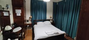 Postel nebo postele na pokoji v ubytování Guesthouse Kazakou
