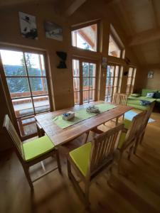 a dining room with a wooden table and chairs at Skihütte in Lachtal
