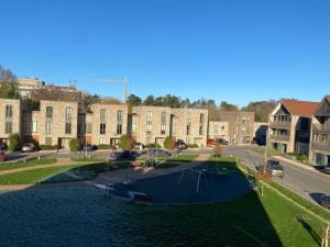 an aerial view of an apartment complex with a playground at Exquisite & Contemporary 2 Bed Apartment w Parking 10 mins walk to Papworth, Addenbrookes hospitals & Bio Medical Campus in Trumpington