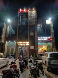 a group of motorcycles parked in front of a building at Hotel Subham Residency and Restaurant in Bikaner +10 photos