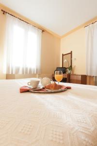a table with a plate of food on a bed at Hotel San Marco in Bedonia +2 photos