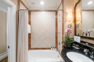 a bathroom with a tub and a sink at InterContinental Mark Hopkins San Francisco, an IHG Hotel in San Francisco