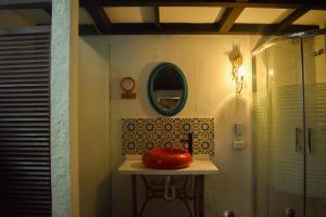 a bathroom with a sink and a shower at Hotel Casa de la Luz in Bogotá