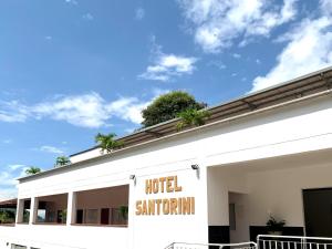 a hotel sign on the side of a building at Hotel Santorini in San Gil