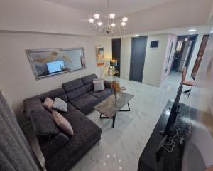 Televízia a/alebo spoločenská miestnosť v ubytovaní master1 seaside lux apartment