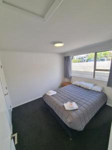 Postel nebo postele na pokoji v ubytování Edward Street Apartments