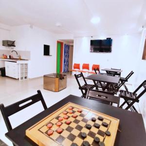 a room with a chessboard on a table with chairs at Hostel Princess Copacabana in Rio de Janeiro