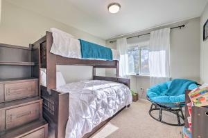 a bedroom with a bunk bed and a chair at Gorgeous San Marco Home with Patio and Gas Grill! in San Marcos