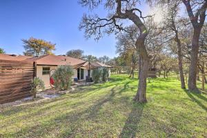 a house with a tree in the yard at Gorgeous San Marco Home with Patio and Gas Grill! in San Marcos