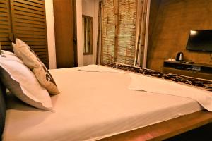 Krevet ili kreveti u jedinici u objektu Amraness Luxury Resort Sasan Gir