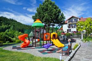a playground in front of a house at Willa Spa Scaliano in Kudowa-Zdrój
