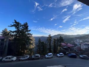 a group of cars parked on the side of a road at Wonder View in Shimla +11 photos