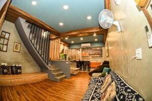 a living room with a staircase in a house at Yonghua 196 in Tainan