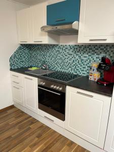 A kitchen or kitchenette at Ferienwohnung Thöny Vandans